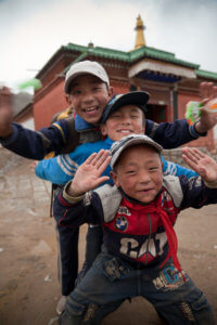 Tibetan kids in Xiahe, China by Mike Moss